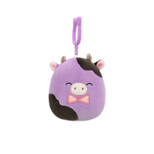 Squishmallows Clip-On Alexie – vijolična in črna krava z metuljčkom, 9 cm